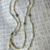 Olive and cream tone long necklace with shell, mother of pearl and stone
