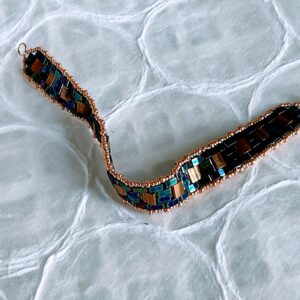 Alternative view of Iridescent blue/purple and gold flat woven TILA bead bracelet